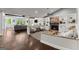 Open-concept living room with stone fireplace, hardwood floors, and ample seating at 1572 Azalea Dr, Lawrenceville, GA 30043