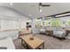 Open-concept living room with partial wall, hardwood floors and views into other rooms at 1572 Azalea Dr, Lawrenceville, GA 30043