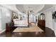 Spacious main bedroom with hardwood floors, ceiling fan, and ensuite bathroom at 1572 Azalea Dr, Lawrenceville, GA 30043