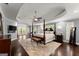 Spacious main bedroom with hardwood floors, tray ceiling, ceiling fan, sitting area, and private balcony at 1572 Azalea Dr, Lawrenceville, GA 30043