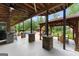 Expansive covered patio featuring an outdoor bar, pool, and cabana perfect for entertaining at 1572 Azalea Dr, Lawrenceville, GA 30043