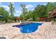Stunning pool and outdoor area with pristine pool, spa, lounge chairs, and a lovely view of a lush, green landscape at 1572 Azalea Dr, Lawrenceville, GA 30043