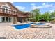 Backyard pool and spa with brick patio and beautiful landscaping at 1572 Azalea Dr, Lawrenceville, GA 30043