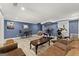 Recreation room featuring an exercise area, comfortable seating, and a small game table at 1572 Azalea Dr, Lawrenceville, GA 30043
