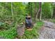 Quaint forest sculpture adds character to the natural path at 1572 Azalea Dr, Lawrenceville, GA 30043