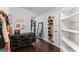 Walk-in closet with shelving, hanging storage, and a dresser for additional storage at 1572 Azalea Dr, Lawrenceville, GA 30043