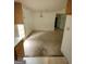 Open-concept dining room with chandelier, needs new flooring at 220 Peach Forest Pl, Douglasville, GA 30134