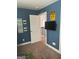 Bright bedroom with a blue accent wall, modern decor, and a view of the landing at 2208 Ginger Lake Ne Dr, Conyers, GA 30013
