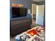 bedroom featuring dark grey dresser, TV, and Marvel themed bedding at 2208 Ginger Lake Ne Dr, Conyers, GA 30013