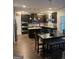 Spacious kitchen with granite countertops, stainless steel appliances, dark cabinets, and breakfast area at 2208 Ginger Lake Ne Dr, Conyers, GA 30013