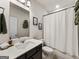 Clean bathroom featuring a vanity with a mirror and a shower with a white curtain at 4065 Holland Grove, Lawrenceville, GA 30044