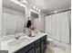 Charming bathroom with double sinks, and classic shower and tub at 4065 Holland Grove, Lawrenceville, GA 30044