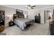 Bright bedroom with decorative headboard, plush carpeting, and adjoining door to another room at 4065 Holland Grove, Lawrenceville, GA 30044