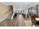 Open-concept living space with hardwood floors and stairs leading to the living room and kitchen at 4065 Holland Grove, Lawrenceville, GA 30044