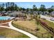 Community playground and pool surrounded by sidewalks, landscaping, and green space at 4065 Holland Grove, Lawrenceville, GA 30044