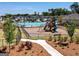 Community playground with slide and swings, pool, landscaping, and sidewalks at 4065 Holland Grove, Lawrenceville, GA 30044
