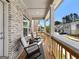 Charming porch with seating and a wooden railing, perfect for enjoying the neighborhood views at 4065 Holland Grove, Lawrenceville, GA 30044