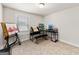 Light room with art easel and desk, featuring window with blinds, and neutral colored carpeting at 4065 Holland Grove, Lawrenceville, GA 30044