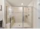 Bright, spacious glass shower with built in bench and decorative tile at 4065 Holland Grove, Lawrenceville, GA 30044