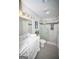 Updated bathroom with a marble vanity, decorative light fixtures, and a glass-enclosed walk-in shower at 909 Ne Otter Way Ne Way, Marietta, GA 30068