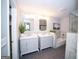 Elegant bathroom featuring dual vanity sinks, marble countertops, and a tiled tub and shower combo at 909 Ne Otter Way Ne Way, Marietta, GA 30068