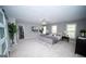 Spacious primary bedroom featuring new carpet, updated ceiling fan, and dual bedside tables at 909 Ne Otter Way Ne Way, Marietta, GA 30068
