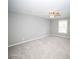 The well-lit bedroom has neutral walls, carpet, a ceiling fan, and a window at 909 Ne Otter Way Ne Way, Marietta, GA 30068
