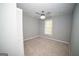 A serene bedroom with neutral paint, carpet, natural light and a ceiling fan for comfort at 909 Ne Otter Way Ne Way, Marietta, GA 30068