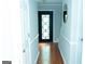 Inviting hallway with hardwood floors, decorative trim, and a stylish front door; perfect for making a grand entrance at 909 Ne Otter Way Ne Way, Marietta, GA 30068
