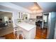 Well-lit kitchen with stainless steel appliances, stylish backsplash, an island with a breakfast bar at 909 Ne Otter Way Ne Way, Marietta, GA 30068