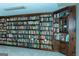 Library showcasing expansive built-in wooden bookshelves filled with a wide variety of books at 909 Ne Otter Way Ne Way, Marietta, GA 30068