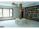 Carpeted living room featuring built-in bookshelves and a large bay window for ample natural light at 909 Ne Otter Way Ne Way, Marietta, GA 30068