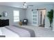 An expansive main bedroom with a ceiling fan and neutral walls provides a serene escape at 909 Ne Otter Way Ne Way, Marietta, GA 30068