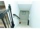Carpeted staircase with decorative metal railing descending into the home's lower level at 909 Ne Otter Way Ne Way, Marietta, GA 30068