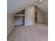 Attic space featuring carpeting, a closet, and natural light at 1555 New Ne St, Atlanta, GA 30307