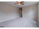 Bright and spacious bedroom with light walls, plush carpet, a ceiling fan, and natural light at 1555 New Ne St, Atlanta, GA 30307