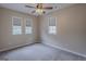 Bedroom featuring two windows, neutral walls, and carpet at 1555 New Ne St, Atlanta, GA 30307