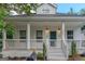 Inviting home with charming front porch and classic architectural details at 1555 New Ne St, Atlanta, GA 30307