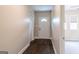 Hallway with wood flooring and a white front door at 1555 New Ne St, Atlanta, GA 30307