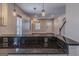 Open kitchen with granite countertops, stainless steel appliances, and modern lighting at 1555 New Ne St, Atlanta, GA 30307