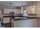 Modern kitchen with stainless steel appliances and granite countertops at 1555 New Ne St, Atlanta, GA 30307