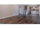 Spacious living area with hardwood floors, staircase, and open access to kitchen, perfect for entertaining at 1555 New Ne St, Atlanta, GA 30307