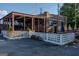 Restaurant featuring a partially covered patio with outdoor seating and industrial design at 1555 New Ne St, Atlanta, GA 30307