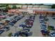 Aerial view of a parking lot in front of Target, Petco, and CVS stores with apartments in the background at 1555 New Ne St, Atlanta, GA 30307
