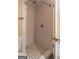 Shower with white subway tile, black and white mosaic floor, and modern fixtures at 1555 New Ne St, Atlanta, GA 30307