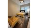 Bright bedroom featuring hardwood floors, a comfortable bed, and a cozy rug at 2148 M L King Jr Sw Dr, Atlanta, GA 30310