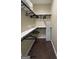 Walk-in closet with hanging racks, shelving and wood flooring perfect for home organization at 2148 M L King Jr Sw Dr, Atlanta, GA 30310