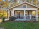 Charming home with a covered front porch, white columns, and a well-maintained lawn in a desirable neighborhood at 2148 M L King Jr Sw Dr, Atlanta, GA 30310