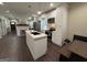 Modern kitchen with stainless steel appliances, white cabinets, a center island, and hardwood floors at 2148 M L King Jr Sw Dr, Atlanta, GA 30310