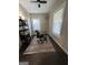 Office space with black rolling chair, desk and bookshelf with great natural lighting at 2148 M L King Jr Sw Dr, Atlanta, GA 30310